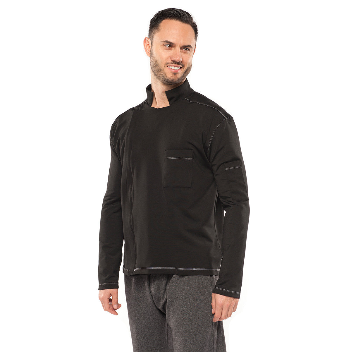 model wearing coat in black and pants in carbon color