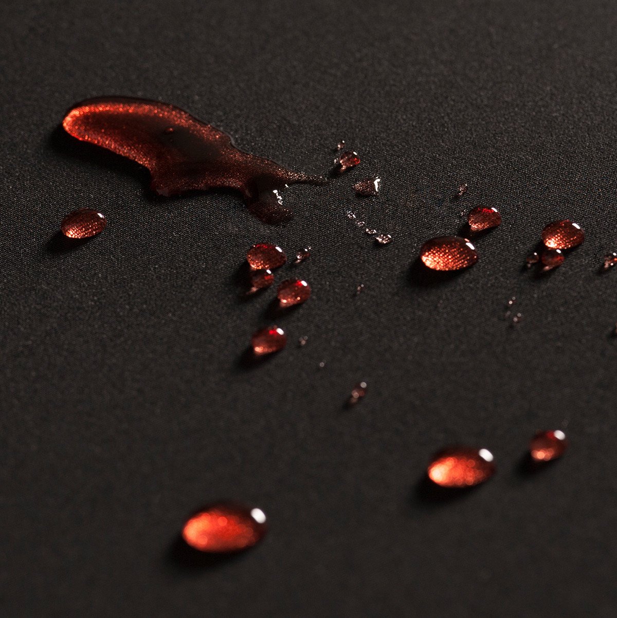 liquid beaded up on water-resistant cloth